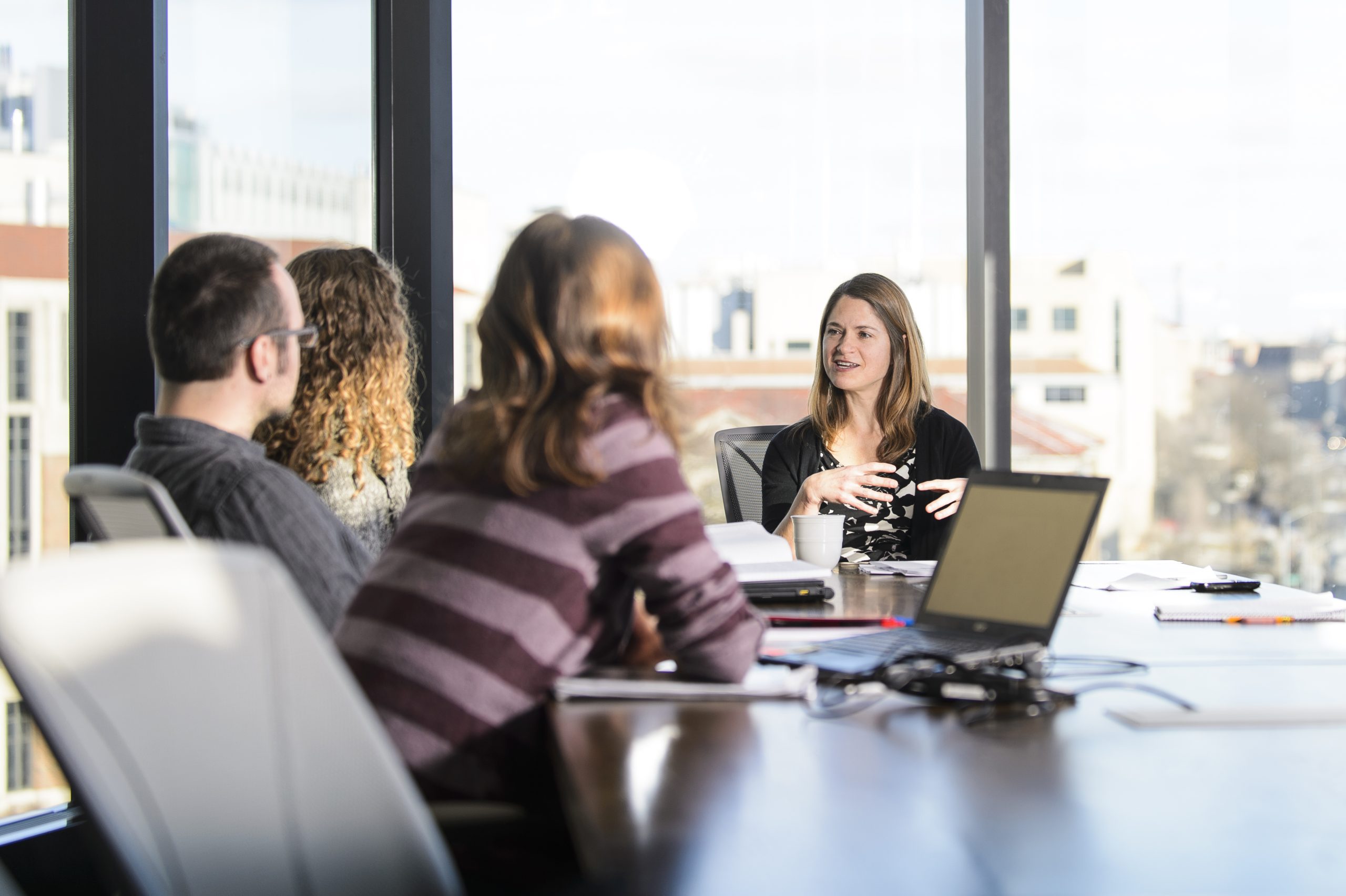 Holly Gibbs, assistant professor in the Department of Geography, meets with her graduate research students in the Wisconsin Energy Institute at the University of Wisconsin-Madison on Feb. 10, 2016. Gibbs is one of twelve 2016 Distinguished Teaching Award recipients. (Photo by Bryce Richter / UW-Madison)